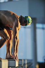 Image showing young swimmmer on swimming start