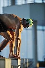 Image showing young swimmmer on swimming start