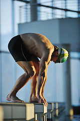 Image showing young swimmmer on swimming start