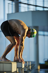 Image showing young swimmmer on swimming start