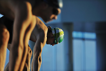 Image showing young swimmmer on swimming start