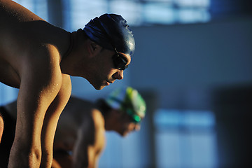 Image showing young swimmmer on swimming start