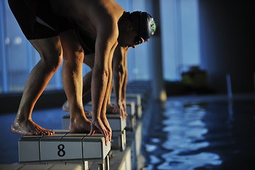 Image showing young swimmmer on swimming start