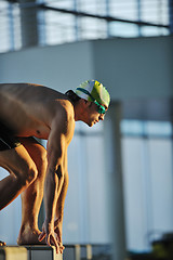 Image showing young swimmmer on swimming start