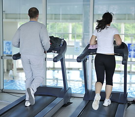 Image showing people running on threadmill at fitness club
