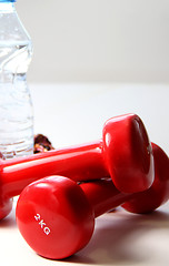 Image showing Red dumbbells and bottle of water