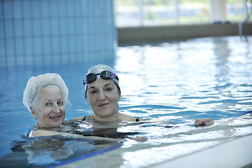 Image showing senior woman at swimming pool