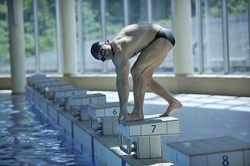 Image showing young swimmer ready for start