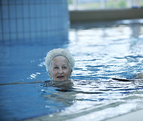 Image showing senior woman at swimming pool