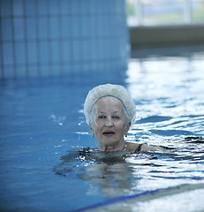 Image showing senior woman at swimming pool