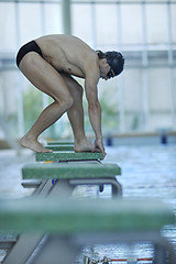 Image showing young swimmer ready for start