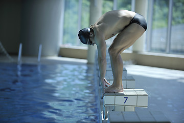 Image showing young swimmer ready for start