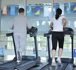 Image showing people running on threadmill at fitness club