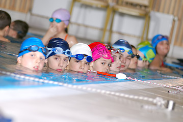 Image showing .childrens in serie at swimming pool 