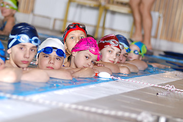 Image showing .childrens in serie at swimming pool 