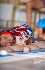 Image showing .childrens in serie at swimming pool 