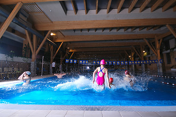 Image showing .happy childs jumping in a swimming pool