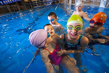 Image showing .happy moments at swimming pool with smilling childrens