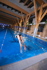Image showing .girl jumping in swimming pool