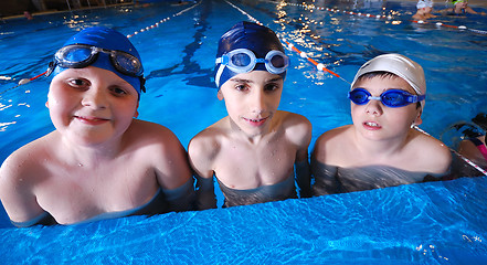 Image showing .childrens in serie at swimming pool 