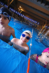 Image showing .childrens in serie at swimming pool 