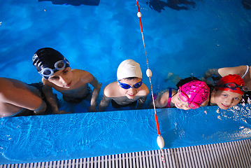 Image showing .childrens in serie at swimming pool 