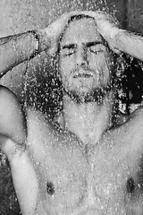 Image showing good looking man under man shower