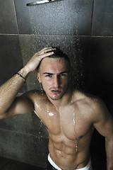 Image showing good looking man under man shower