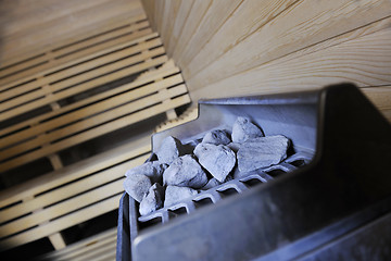 Image showing hot stones and splashing water in sauna