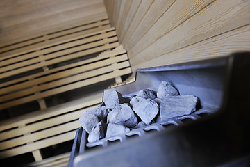 Image showing hot stones and splashing water in sauna