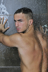 Image showing good looking man under man shower