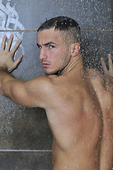 Image showing good looking man under man shower