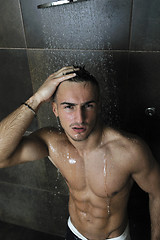 Image showing good looking man under man shower