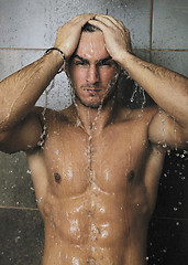 Image showing good looking man under man shower