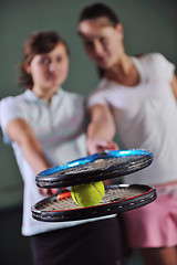 Image showing young girls playing tennis game indoor