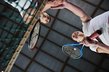 Image showing young girls playing tennis game indoor