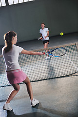 Image showing young girls playing tennis game indoor