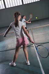 Image showing young girls playing tennis game indoor