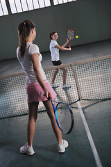 Image showing young girls playing tennis game indoor