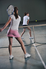 Image showing young girls playing tennis game indoor