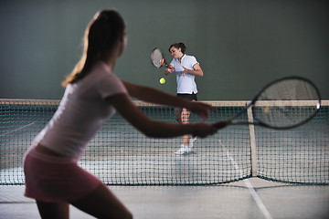 Image showing young girls playing tennis game indoor