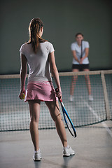 Image showing young girls playing tennis game indoor