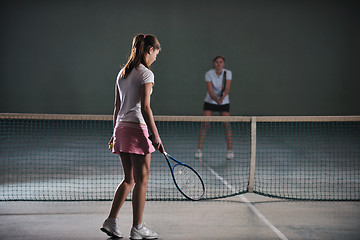 Image showing young girls playing tennis game indoor