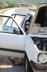 Image showing Young woman waiting in car