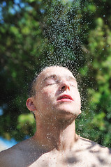 Image showing man wash head under shower with falling water