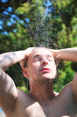 Image showing man wash head under shower with falling water