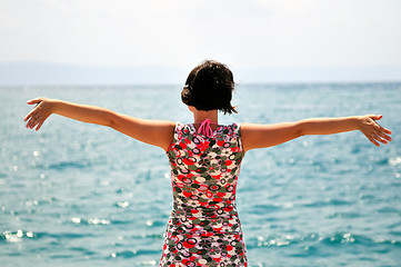 Image showing Young pretty woman enjoying the sun