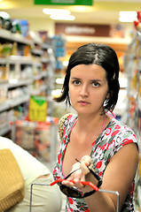 Image showing Young woman shopping in market 