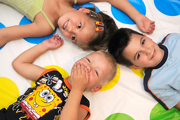 Image showing Happy three kids playing together