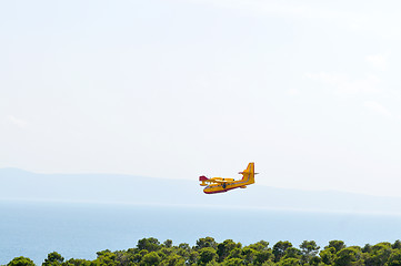 Image showing Airplane on sea taking water